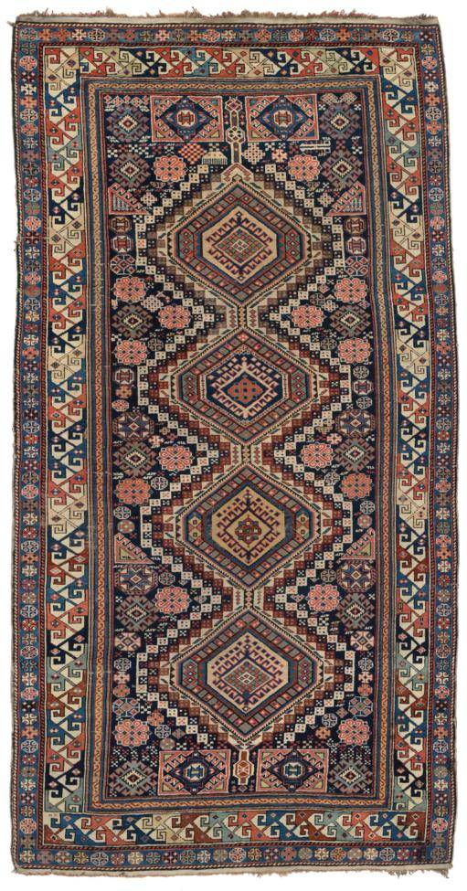 Lot 756 - Fine Shirvan Rug East Caucasus, 19th century The deep indigo field with a column of stepped...