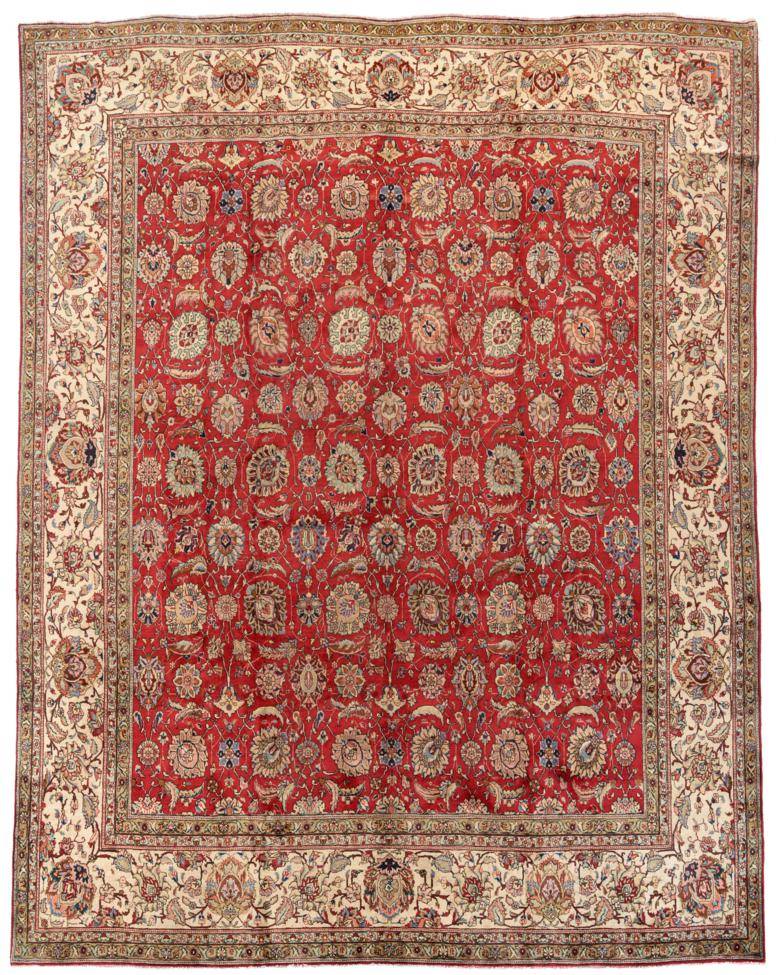 Lot 759 - Tabriz Carpet, of unusual size Iranian Azerbaijan, circa 1950 The deep brick red field with an...