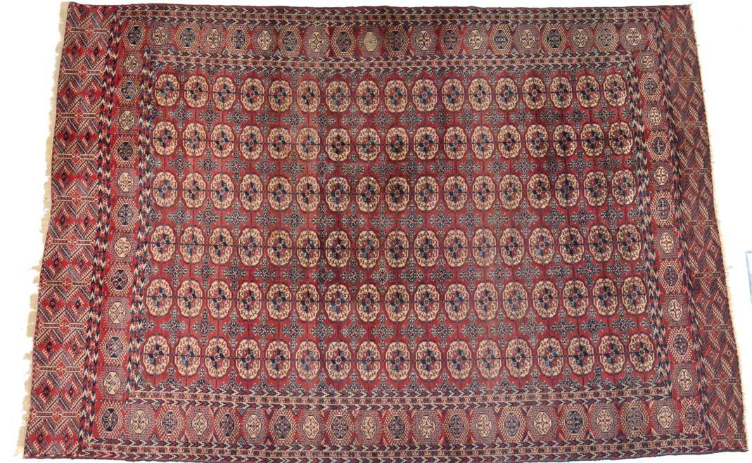 Lot 760 - Tekke Carpet Emirate of Bukhara, circa 1900 The madder field with six columns of quartered...