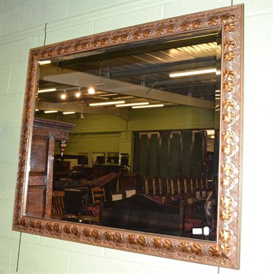 Lot 415 - A large modern rectangular wall mirror with ivy leaf and vine frame