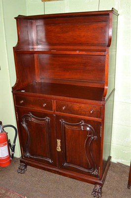 Lot 429 - Mahogany waterfall bookcase with cupboard doors and carved claw feet