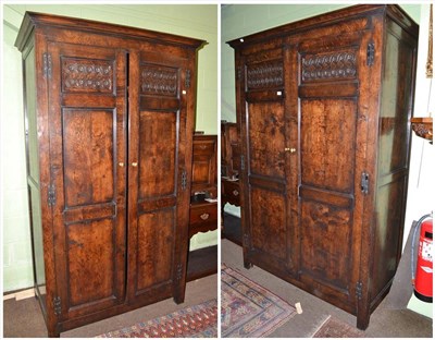 Lot 431 - Bulaw reproduction double wardrobe and another of similar design with carved friezes