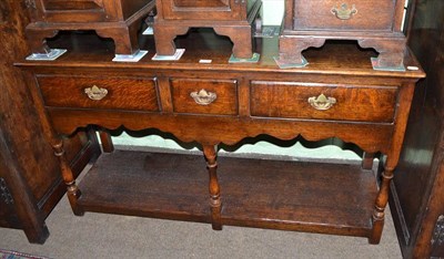 Lot 432 - Titchmarsh & Goodwin oak dresser base, with three drawers and pot cupboard base