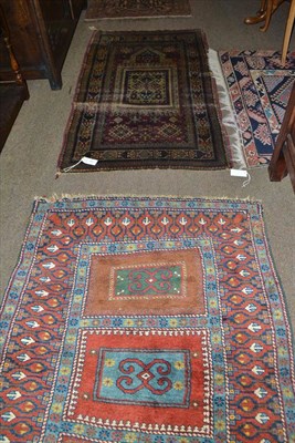 Lot 434 - Derband rug, East Caucasus, the compartmentalised field of hooked devices enclosed by rust borders