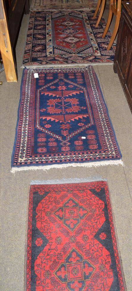 Lot 444 - Bergama rug, West Anatolia, the deep indigo field with stepped medallions framed by spandrels...