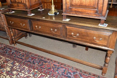 Lot 459 - Reproduction oak sideboard with three drawers and stretcher base