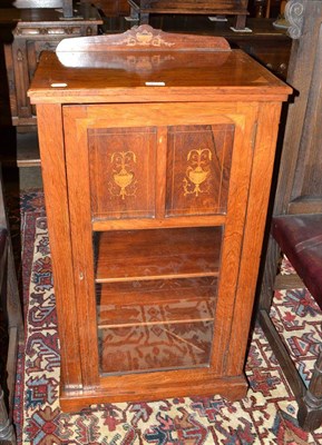 Lot 467 - A Victorian walnut inlaid music cabinet