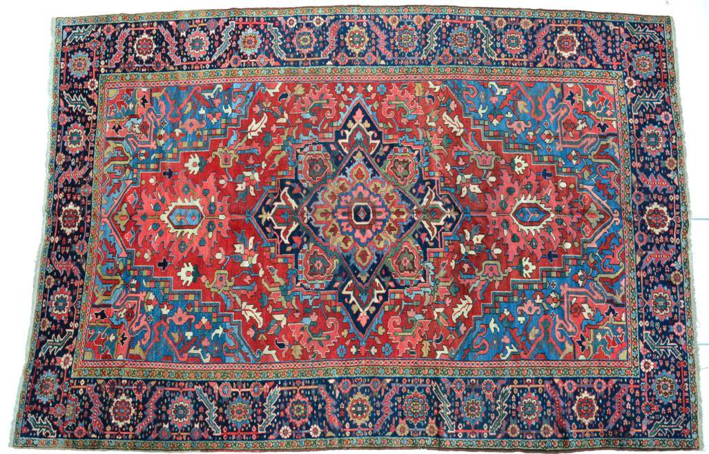 Lot 770 - Heriz Carpet Iranian Azerbaijan, circa 1900 The tomato field of angular vines centred by a deep...