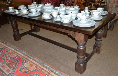 Lot 475 - Reproduction oak refectory type table and eight carved oak dining chairs including two carvers (9)