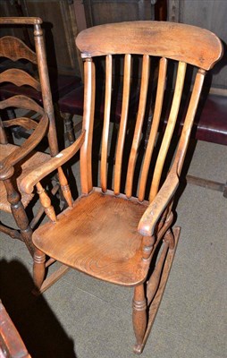 Lot 477 - Victorian elm seated rocking chair (loose arm) and modern wall mirror (2)