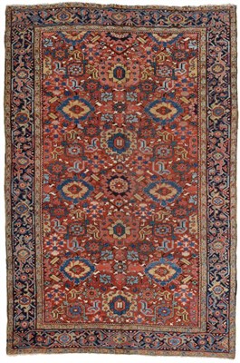 Lot 771 - Unusual Heriz Carpet Iranian Azerbaijan, circa 1900 The brick red field with columns of...