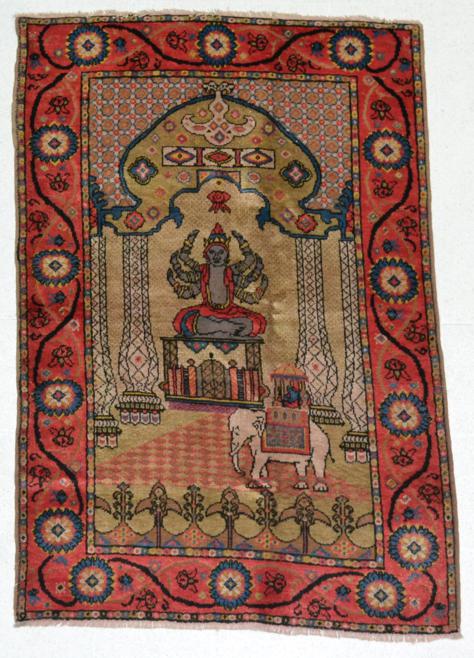Lot 774 - Rare Silk Piled Rug East Turkestan, probably Khotan, circa 1920 The field with a mythical deity...