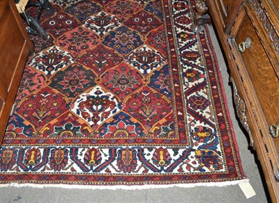 Lot 506 - Bakhtiari carpet, West Persia, the polychrome diamond lattice field of plants and flowers...