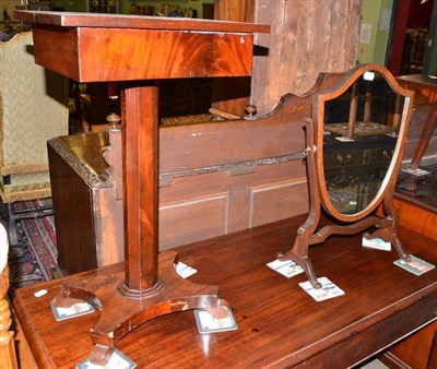 Lot 515 - A small William IV mahogany side table with platform base and a shield shape mahogany toilet mirror