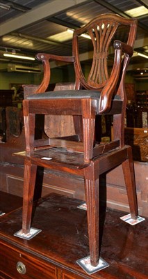 Lot 518 - A child's Hepplewhite design armchair with shield back and out-swept arms, raised on a matching...