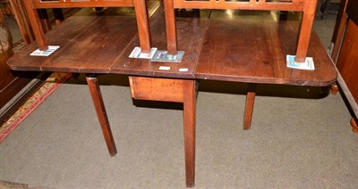 Lot 535 - A mahogany gateleg dining table