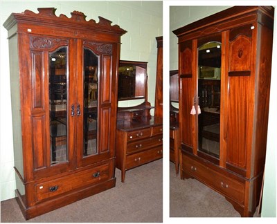 Lot 538 - Edwardian mahogany inlaid wardrobe, dressing table and carved double wardrobe (3)