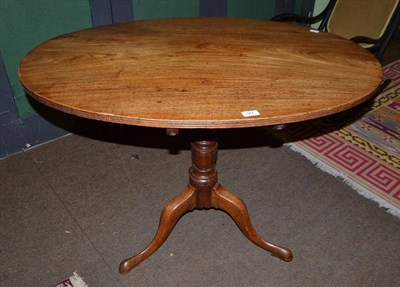 Lot 547 - A 19th century mahogany oval tilt top breakfast table