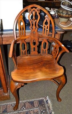 Lot 561 - Reproduction armchair with arched back and crinoline stretcher