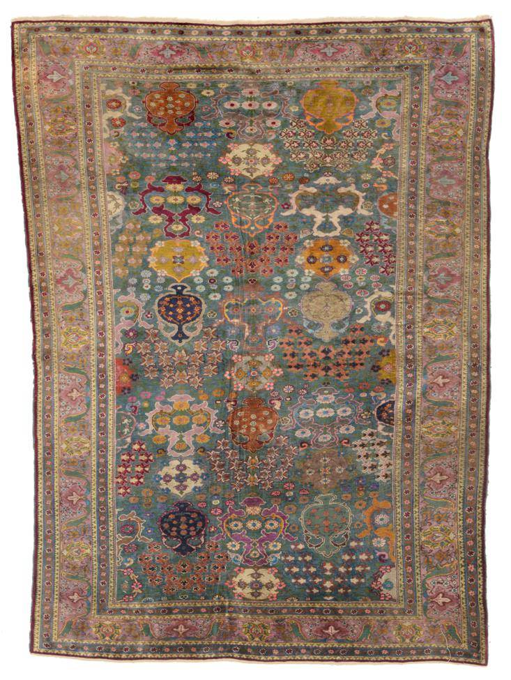 Lot 780 - Antique Turkish Silk Rug Possibly Kum Kapi, Istanbul The blue green field or urns issuing...