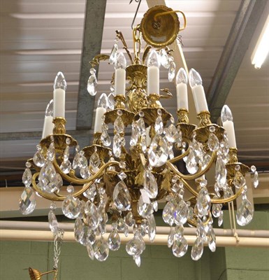 Lot 562 - Heavy two tier modern brass chandelier with glass drops