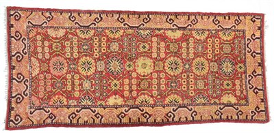 Lot 781 - Khotan Rug East Turkestan, early 20th century The madder field centred by a column of...