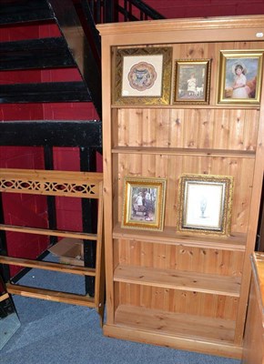 Lot 581 - A pine bookcase and pine wall rack