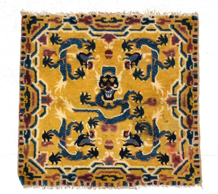 Lot 782 - Ningxia Seat Cover North China, circa 1900 The mustard field centred by a dragon surrounded by four