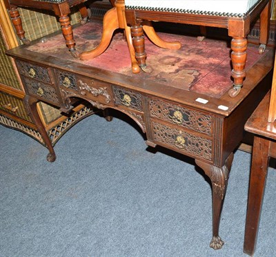 Lot 590 - A Chippendale revival carved mahogany desk on claw feet