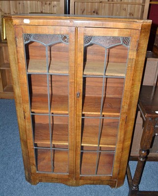 Lot 592 - An Art Deco mahogany display cabinet with leaded stained glass doors