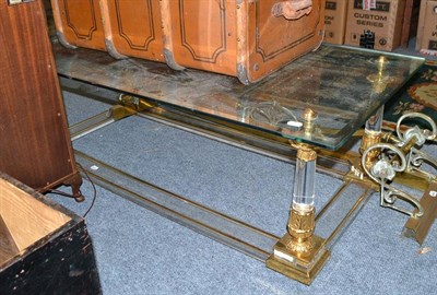 Lot 601 - A modern glass and brass rectangular coffee table