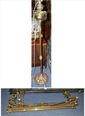 Lot 602 - Telescopic brass standard lamp and a brass fender