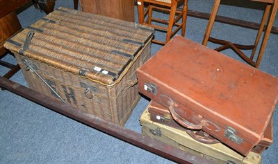 Lot 607 - A large wicker hamper and three leather suitcases (4)