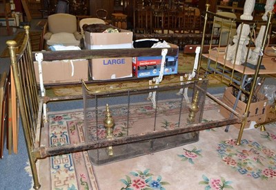 Lot 630 - A single brass bed, brass mounted nursery fire guard and a pair of brass mounted fire dogs