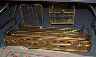 Lot 632 - Three brass fenders, a brass folding spark guard and a mirrored brass firescreen