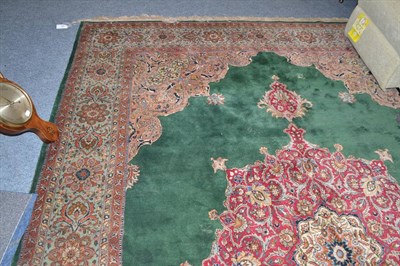 Lot 654 - European carpet of Tabriz design, the moss green field centred by a raspberry medallion framed...