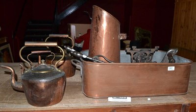 Lot 661 - A quantity of brass and copper including settling pan, three kettles, fire irons, andirons, etc