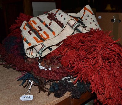 Lot 664 - A Balouch button and bead decorated pillow, an Afghan camel headdress, an Afghan saddle bag, a...