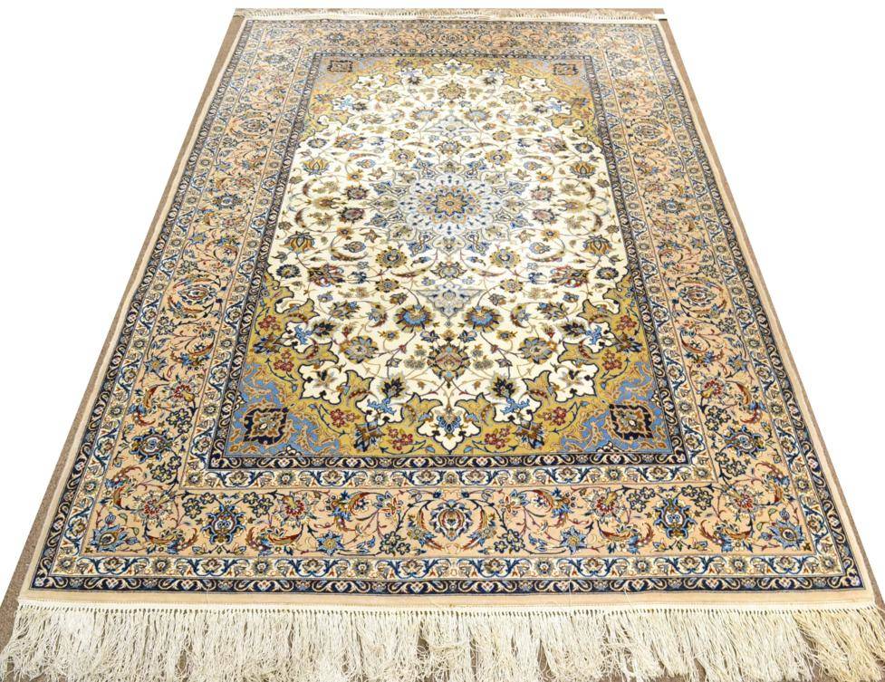 Lot 794 - Fine Isfahan Rug Central Iran, circa 1950 The ivory field of scrolling vines centred by a...