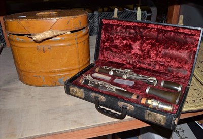 Lot 684 - Cased clarinet, black bowler hat and a tin hat box (3)