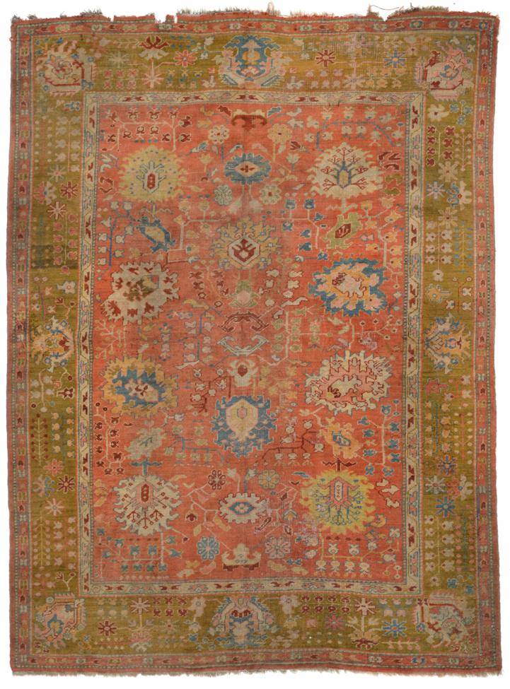 Lot 797 - Borlu Carpet of unusual size Central/West Anatolia, circa 1900 The coral pink field with columns of