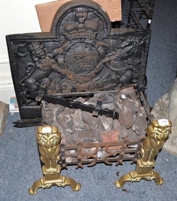 Lot 704 - A cast iron fire grate with fire back and a pair of brass mounted fire dogs