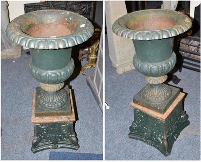 Lot 706 - Pair of green painted cast iron pedestal planters on stands