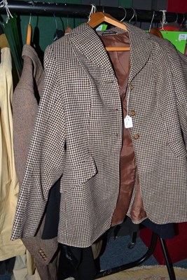 Lot 720 - A brown tweed overcoat, another, dinner suite with tails and a Harry Hall checked hacking...