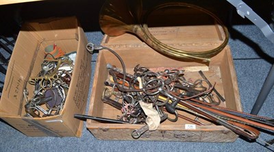 Lot 726 - Brass circular horn, assorted whips, spurs, stirrups, hinged box with caned mount, bits etc