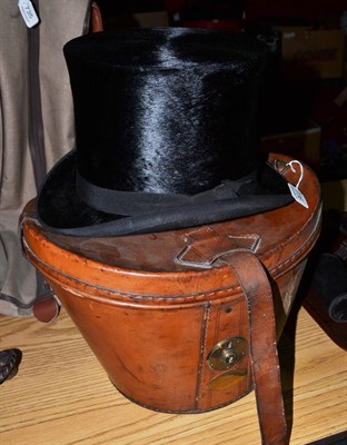 Lot 736 - Black silk top hat and leather hat box