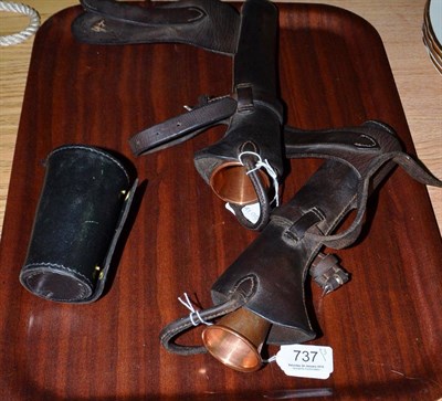 Lot 737 - Two copper hunting horns in fitted leather cases and a black leather cased set of drinking tumblers