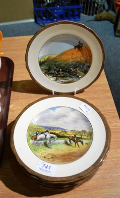 Lot 741 - Twelve Copeland pottery plates decorated with hunting scenes, designed by Lionel Edwards