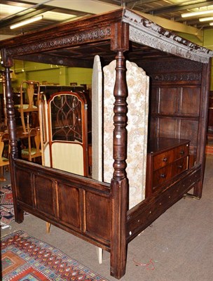 Lot 442A - Oak panelled composition four poster bed with carved friezes and wooden head and foot board