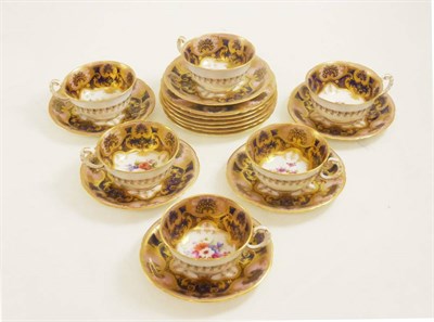 Lot 18 - A set of six Royal Worcester cups, saucers and plates - painted with flowers on rich royal blue...